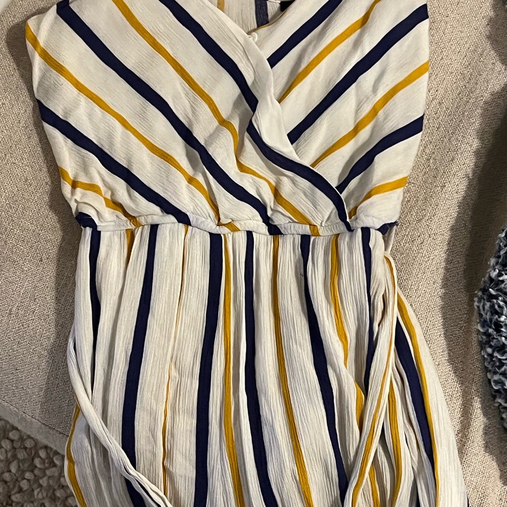 Medium size jumpsuit- brand is Stacatto. Barely worn. Tie waste.